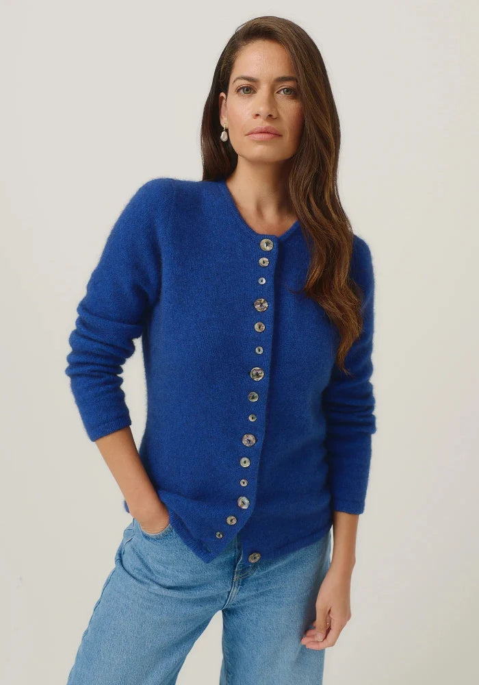 Possum and Merino

1736 Shell Cardi - Our signature Shell Cardi is a Merinomink staple, loved for its simple lines and statement buttons. A fitted silhouette offers a smart and refined look that can dress and up and down with ease. Slim fit.&nbsp;

Made in New Zealand from an exclusive Merinomink blend of 50% ZQ Merino, 40% Brushtail possum and 10% Mulberry silk.