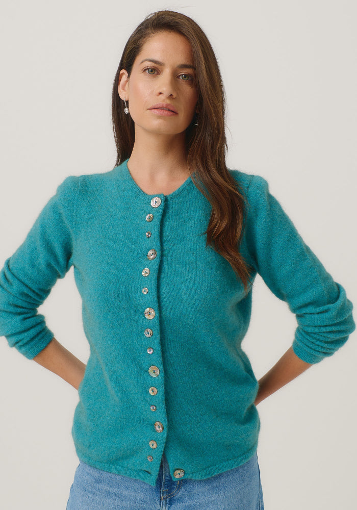 Possum and Merino

1736 Shell Cardi - Our signature Shell Cardi is a Merinomink staple, loved for its simple lines and statement buttons. A fitted silhouette offers a smart and refined look that can dress and up and down with ease. Slim fit.&nbsp;

Made in New Zealand from an exclusive Merinomink blend of 50% ZQ Merino, 40% Brushtail possum and 10% Mulberry silk.