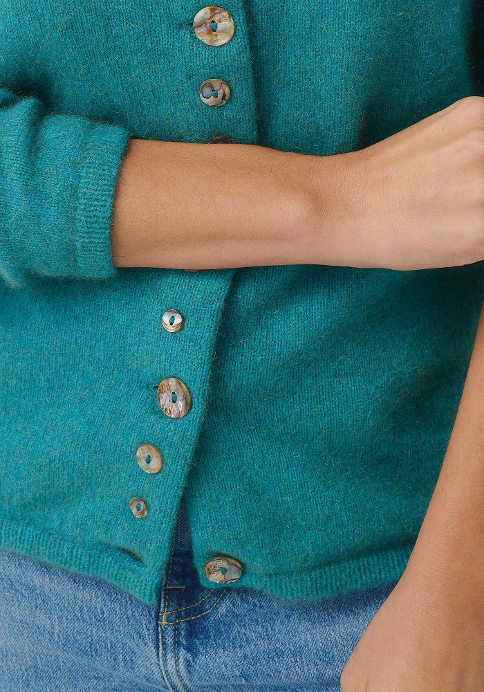 Possum and Merino

1736 Shell Cardi - Our signature Shell Cardi is a Merinomink staple, loved for its simple lines and statement buttons. A fitted silhouette offers a smart and refined look that can dress and up and down with ease. Slim fit.&nbsp;

Made in New Zealand from an exclusive Merinomink blend of 50% ZQ Merino, 40% Brushtail possum and 10% Mulberry silk.