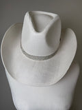 Ivory structured cowboy hat with rhinestone embellishment along the brim for a polished western glam look.