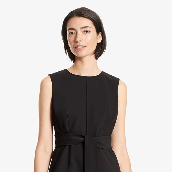 Front image of a woman standing wearing the Angelina top in Black | Exclude