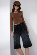 Black washed denim Bermuda shorts with allover crystal stud embellishment and classic five-pocket styling.
