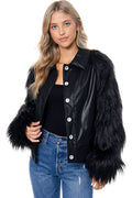 Black cropped collared jacket with a faux leather body, button front, and voluminous black faux fur sleeves.