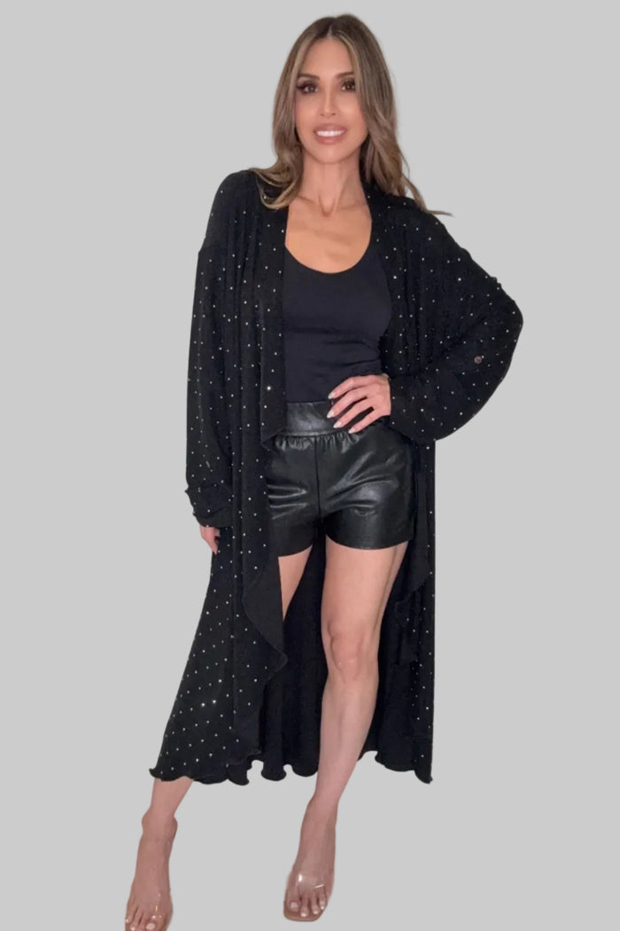 Black long open-front duster jacket with studded embellishment, relaxed drape, and a flowy hem.