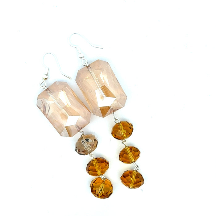 Style the Champagne Rectangle Dangle Crystal Earrings exclusively at Born To Glam