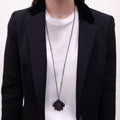 CHANEL BLACK CRYSTAL CROSS WITH LOGO