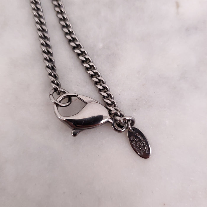 CHANEL BLACK CRYSTAL CROSS WITH LOGO