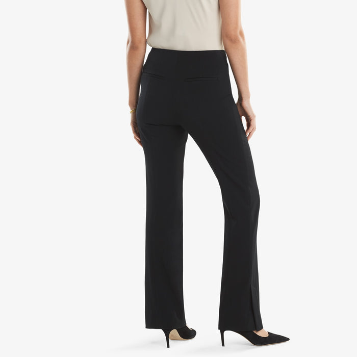 Back image of a woman standing wearing the Clooney in light twill in black.