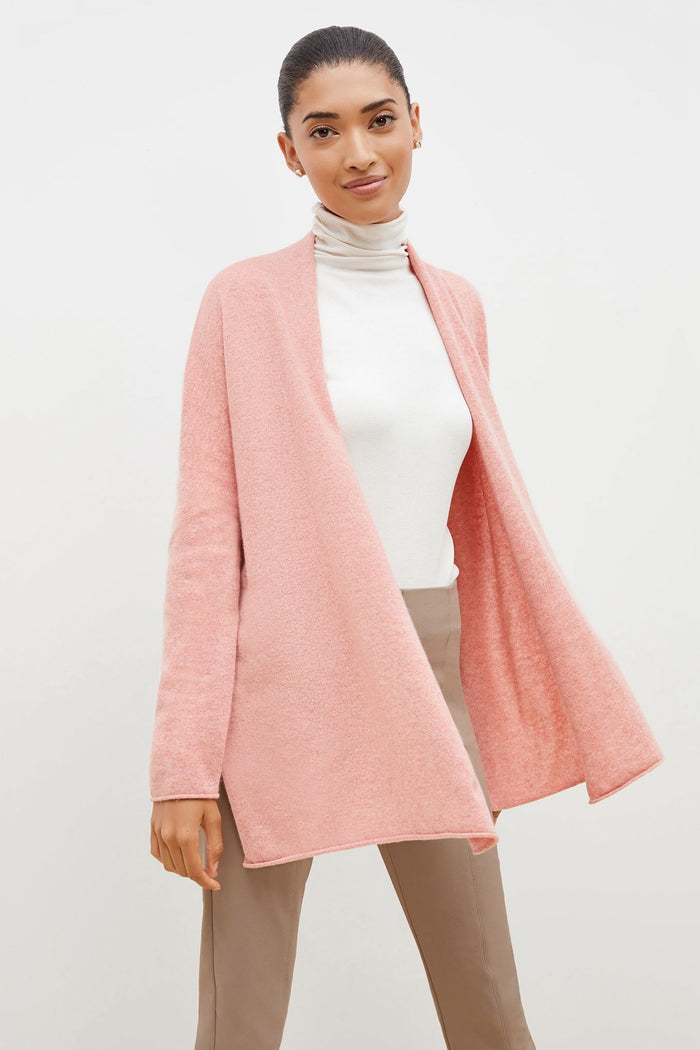 Front image of a woman standing wearing the Daphne sweater in Rose Heather | Grid | Exclude
