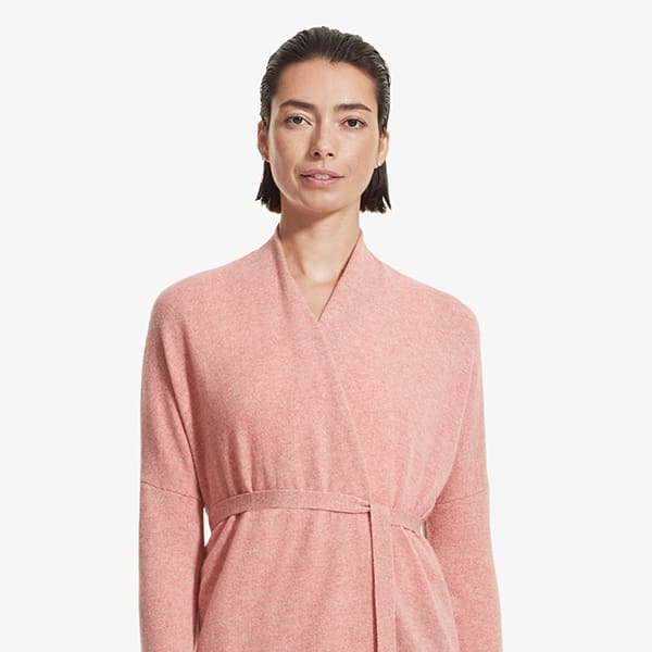 Front image of a woman standing wearing the Daphne sweater in Rose Heather | Exclude