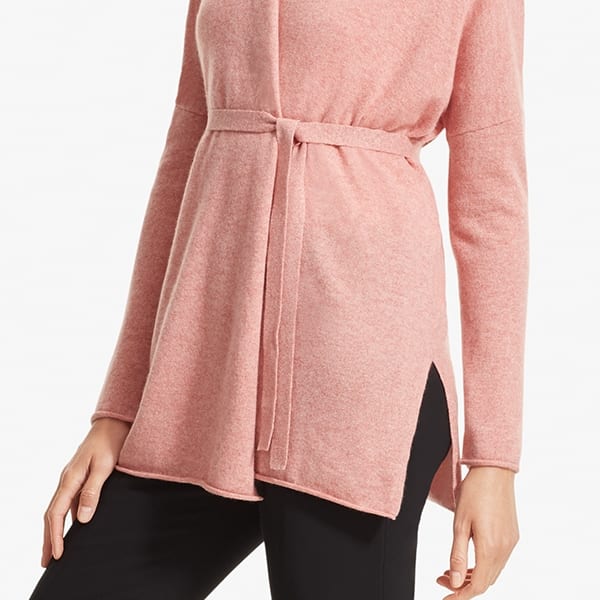 Side image of a woman standing wearing the Daphne sweater in Rose Heather | Exclude