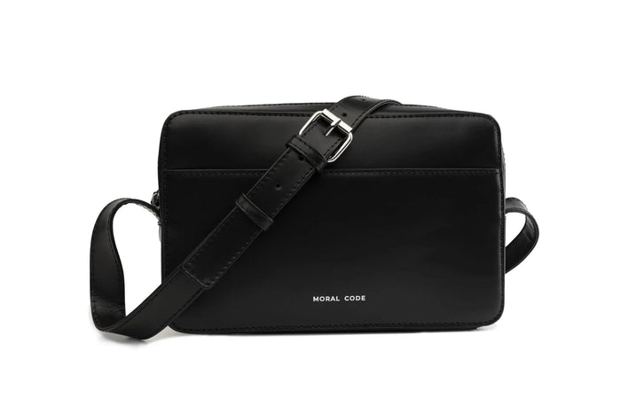Black leather crossbody bag with 'Moral Code' branding