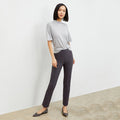 Front image of a woman standing wearing the foster pant in monsoon | Lead