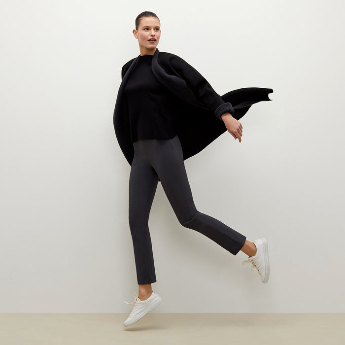 Front image of a woman standing wearing the foster pant in monsoon