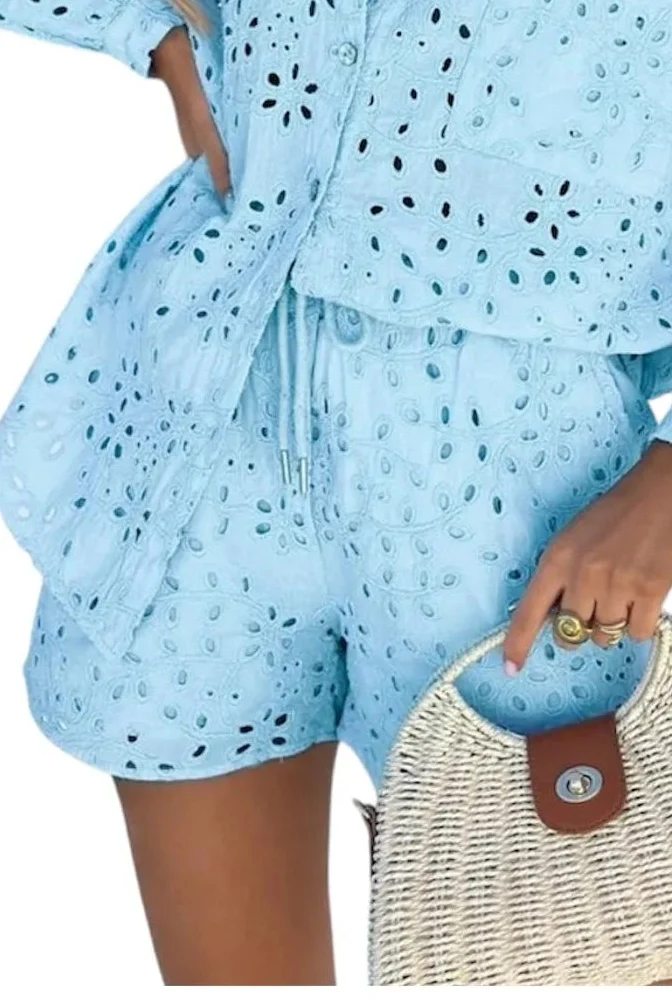 Italian crochet shorts with a herringbone lace texture, relaxed silhouette, and drawstring elastic waistband for resort-inspired summer styling.