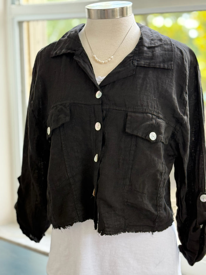 Black Italian linen jacket layered over a white top