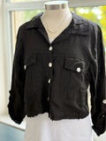 Black Italian linen jacket layered over a white top