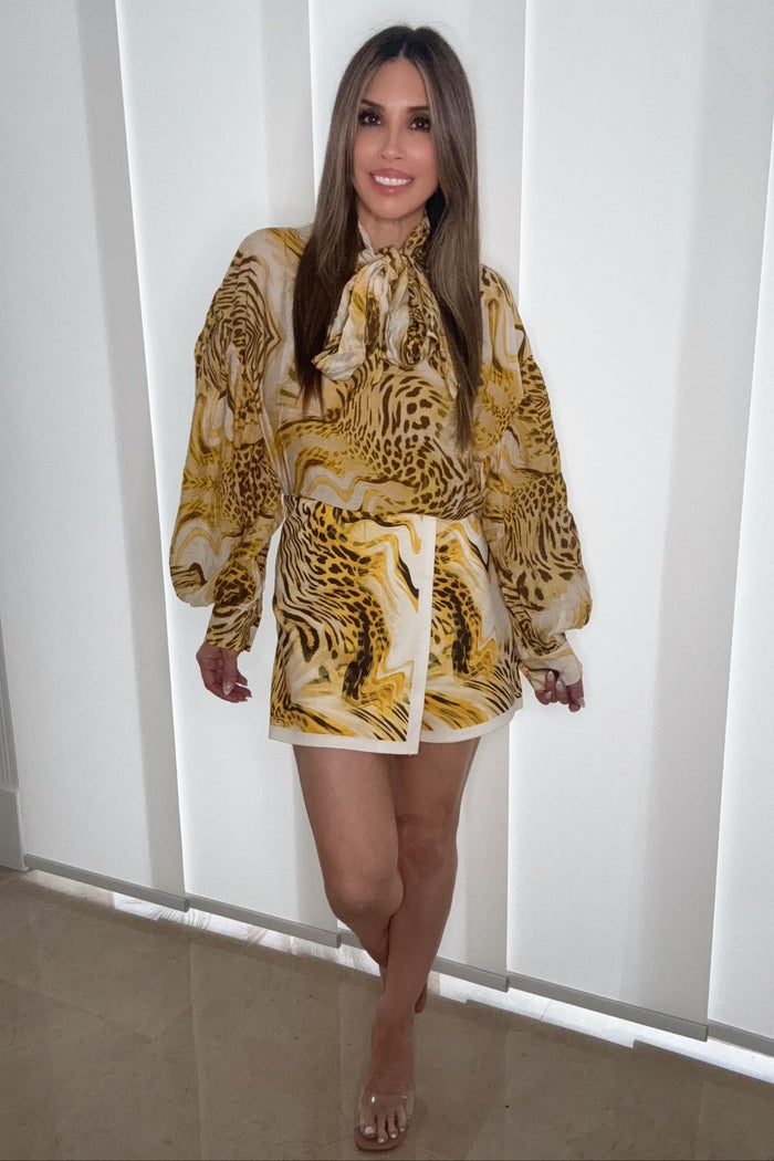 Style the Leopard Print Balloon Sleeves Tie Neck Blouse exclusively at Born To Glam