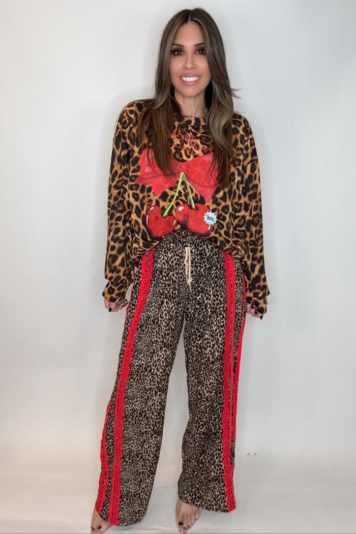 Style the Red Ribbon Detail Leopard Print Pants exclusively at Born To Glam