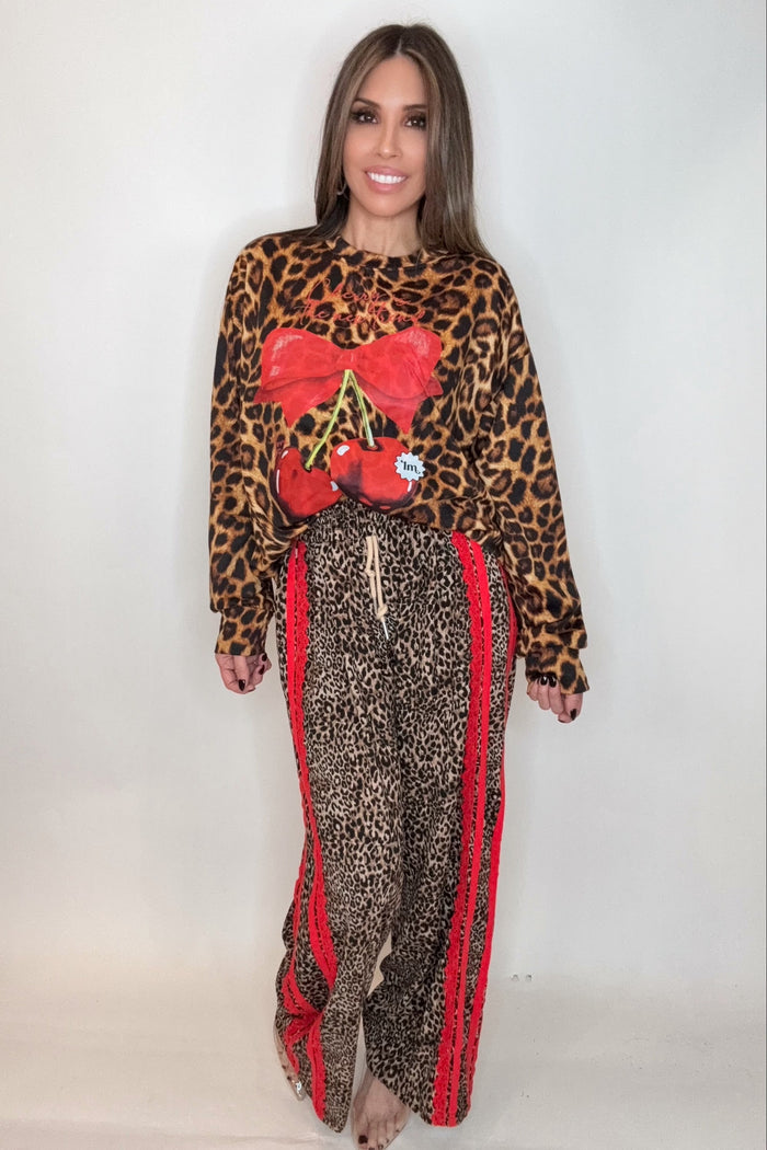 Style the Red Ribbon Detail Leopard Print Pants exclusively at Born To Glam