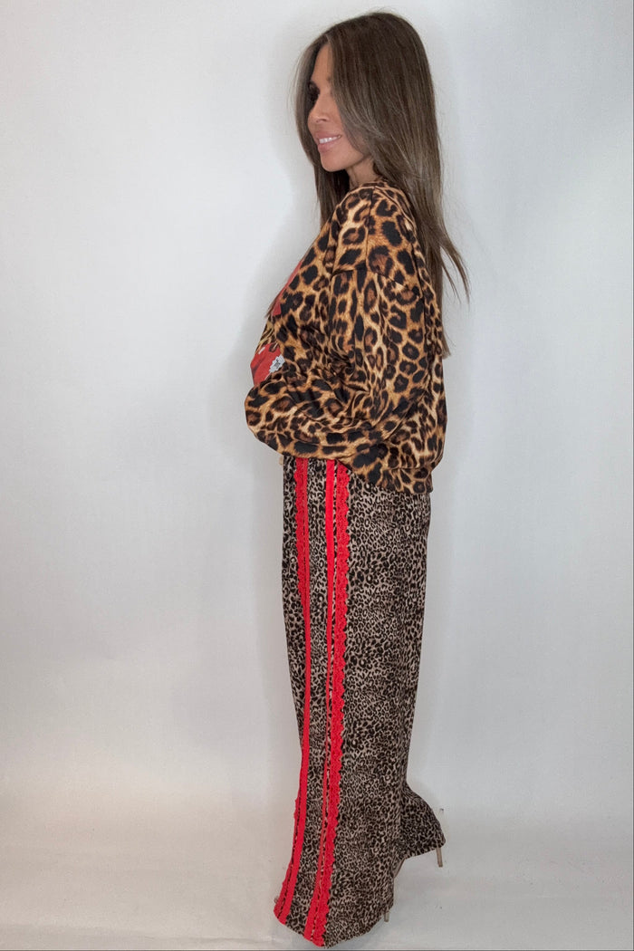 Style the Red Ribbon Detail Leopard Print Pants exclusively at Born To Glam