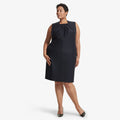 Front image of a woman standing wearing the Lucinda dress sharkskin in Ink | Lead