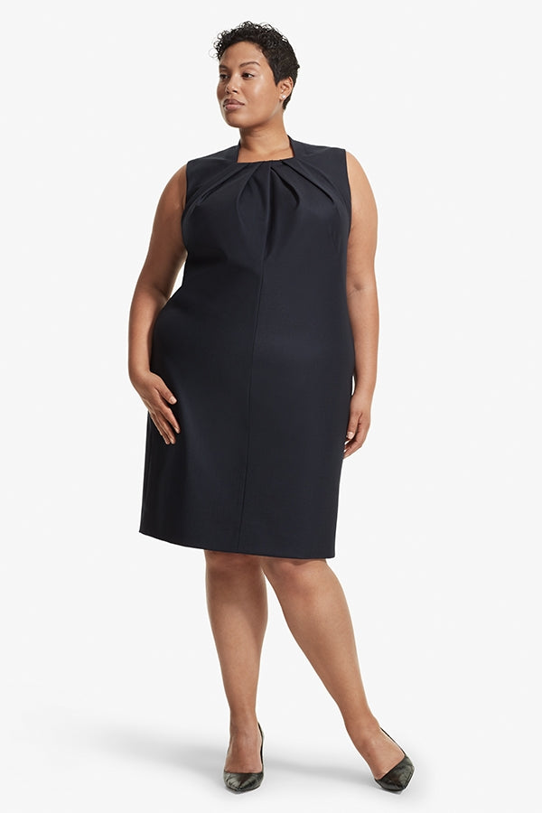 Front image of a woman standing wearing the Lucinda dress sharkskin in Ink | Grid | Exclude