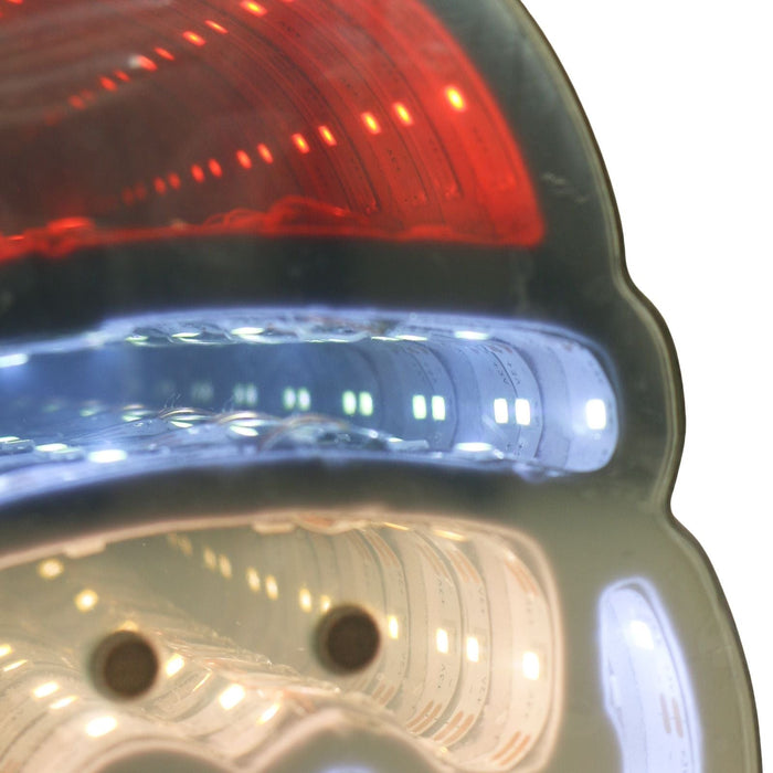 Close-up of a santa face light with red and blue lights.