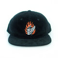 A black corduroy baseball cap from The Front Bottoms, featuring a flaming skull in a winged helmet and "1776" embroidered on the front, shown head-on against a white background. Ideal for fans of bold embroidered hats.