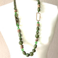 Olive green wooden beaded long necklace with natural bead shapes and an earthy statement jewelry design.
