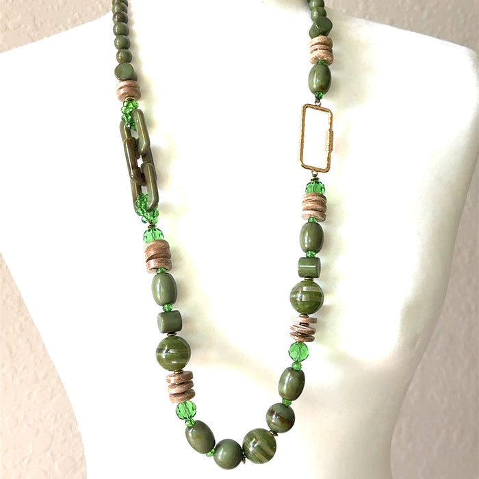 Olive green wooden beaded long necklace with natural bead shapes and an earthy statement jewelry design.