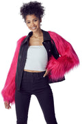 Pink faux fur sleeve jacket with a black faux leather body and snap-front closure.