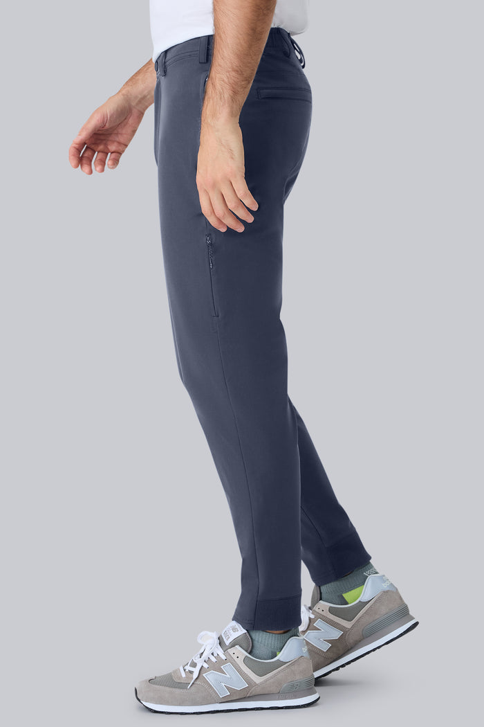 Side view of a man wearing Radius Flex Jogger in True Navy