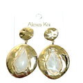 Round gold earrings with a polished circular design and a gemstone center detail.