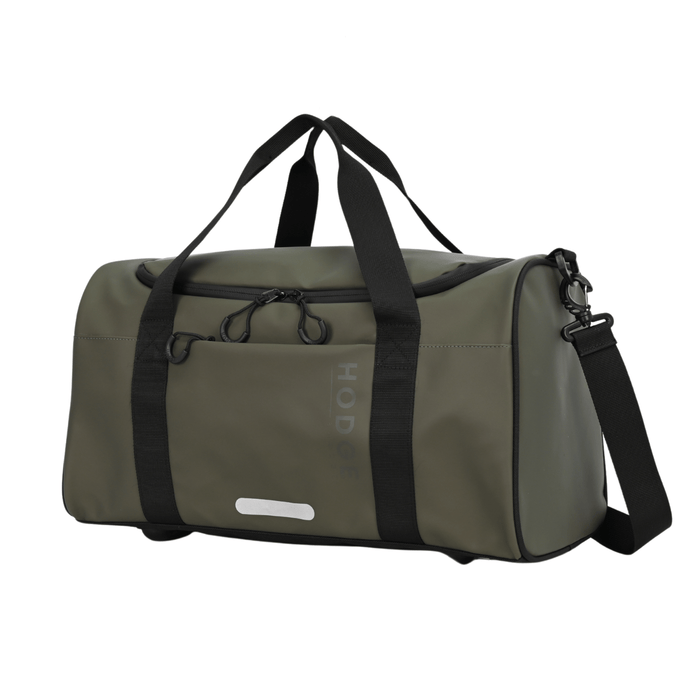 side view of olive green hodge and hodhe duffle bag with black carry handles and reflective details on the front