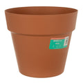 Round terracotta garden planter in plastic