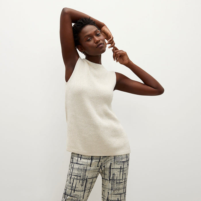 Front image of a woman standing wearing the Spardel top in ivory | Lead