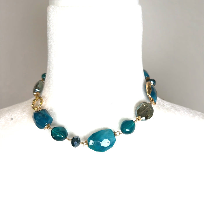 Turquoise crystal beaded short necklace with faceted blue-green beads, crystal accents, a silver-tone chain, and lobster clasp closure.