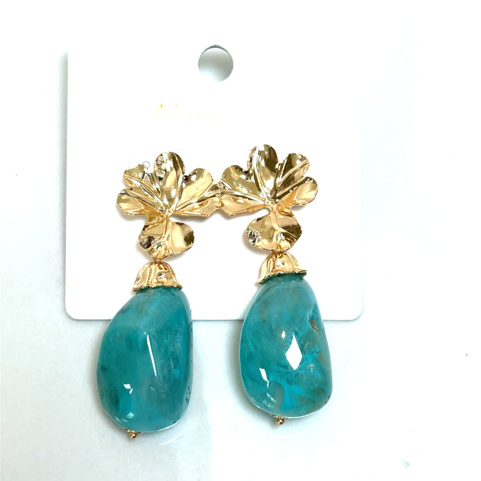 Turquoise and gold floral statement earring with vibrant stone detail and polished gold accents.