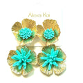 Turquoise and gold-tone oversized flower statement earrings with sculpted petal texture and a bold dimensional floral design.