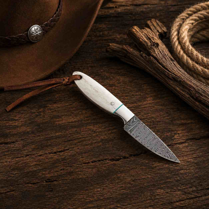 Unmatched Craftsmanship: Damascus Steel Buckaroo Knife with Camel Bone Handle - RFE Marketing Ventures